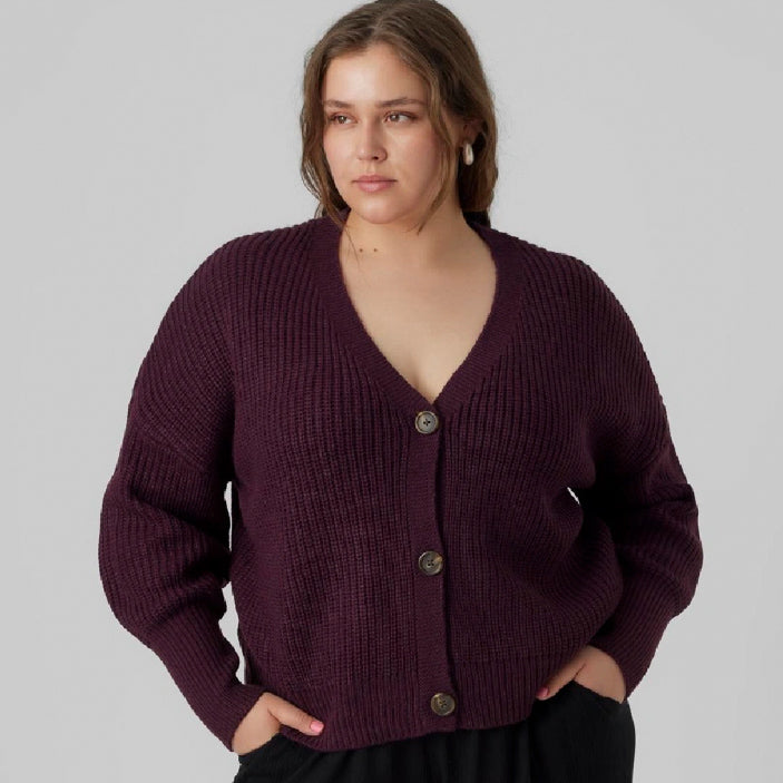 Plus sized woman wearing a trendy and comfortable button up cardigan 