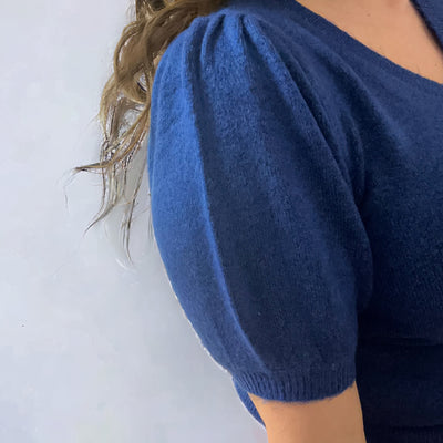 Blue knit sweater with a puffed short sleeve