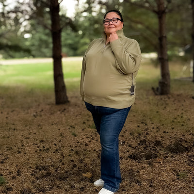 Curvy woman wearing Brunette  the labels not your boyfriend’s half zip sweat shirt in olive 