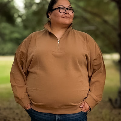 Curvy plus sized woman wearing a comfortable and cozy half zip sweat shirt in fawn 