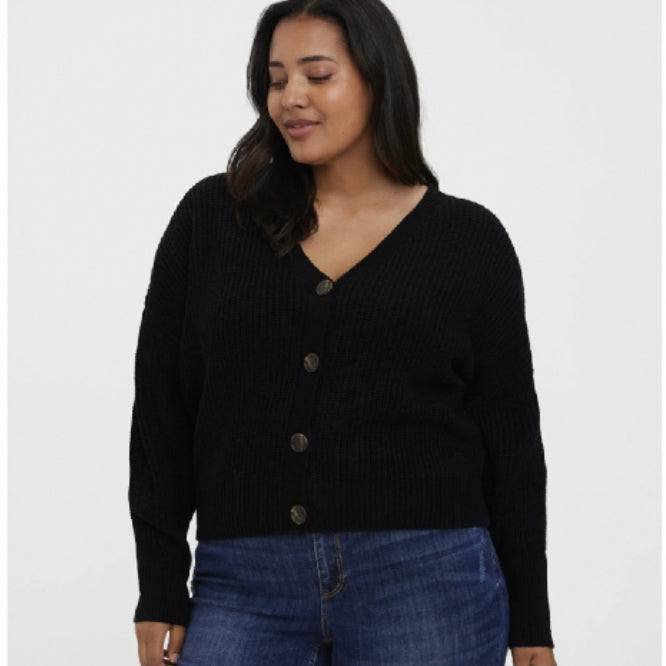 Curvy plus sized woman wearing a trendy and comfortable black button up cardigan 