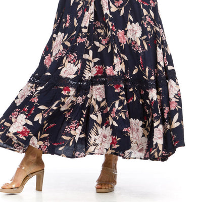 navy and floral print maxi dress with lace detail on bottom skirt