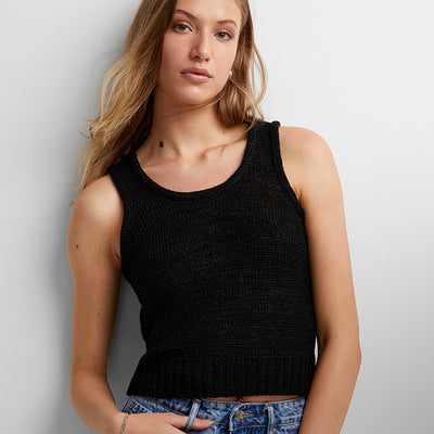 Woman wearing a black charity tank by Vero Moda 