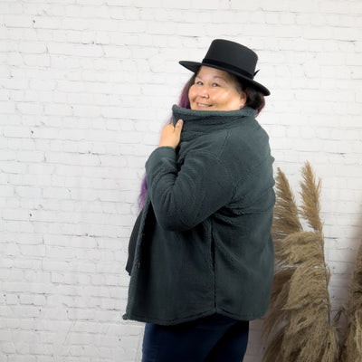 curvy woman wearing a soft and comfortable teddy bear shacket 