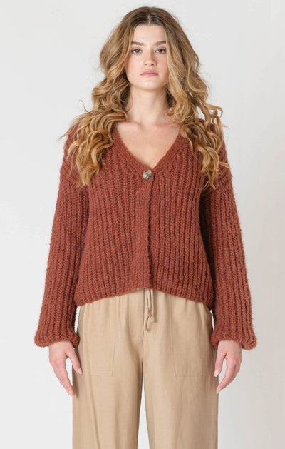 Woman wearing a cozy orange melange  knitted sweater for fall
