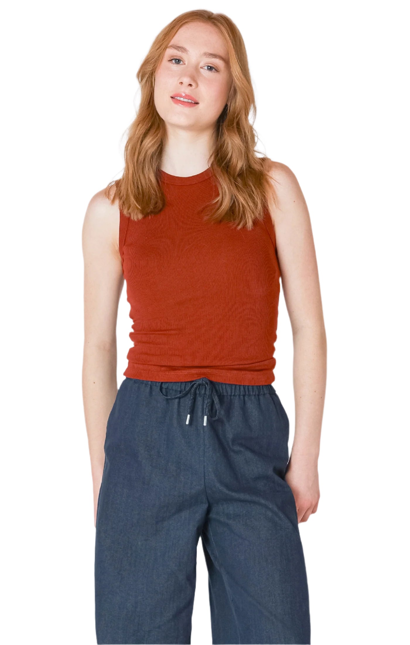 Woman wearing a cute and comfortable burnt orange sleeveless top 