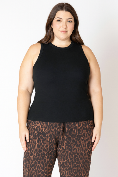 plus size Woman wearing a soft black ribbed sleeveless top 